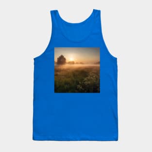 Sunrise over a green meadow fog rises in the summer Tank Top